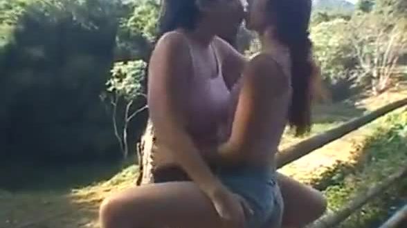 Lesbians kissing in nature