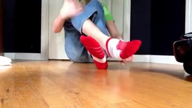 Teen howing her feet and stick